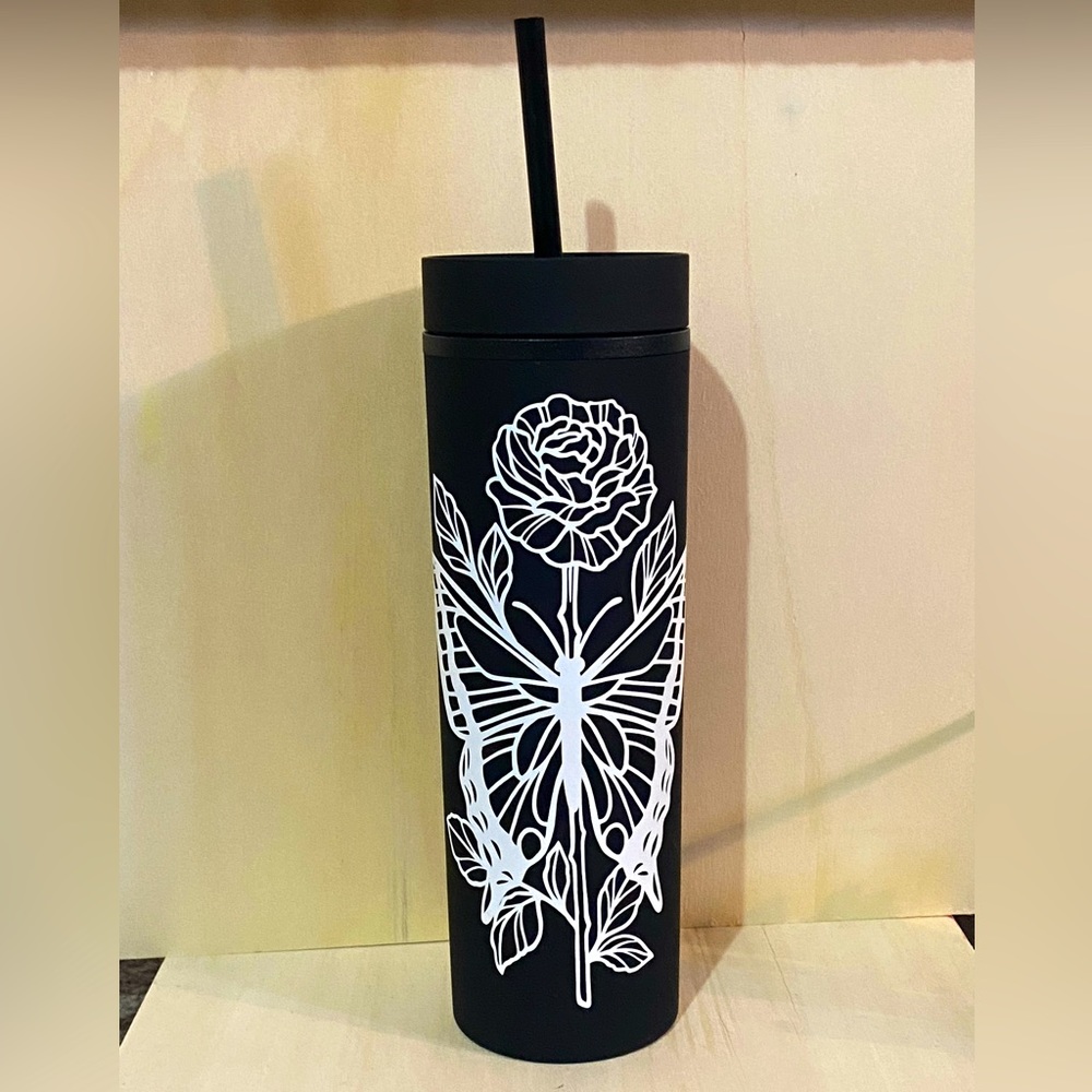 Black to-go cup with white floral/butterfly design